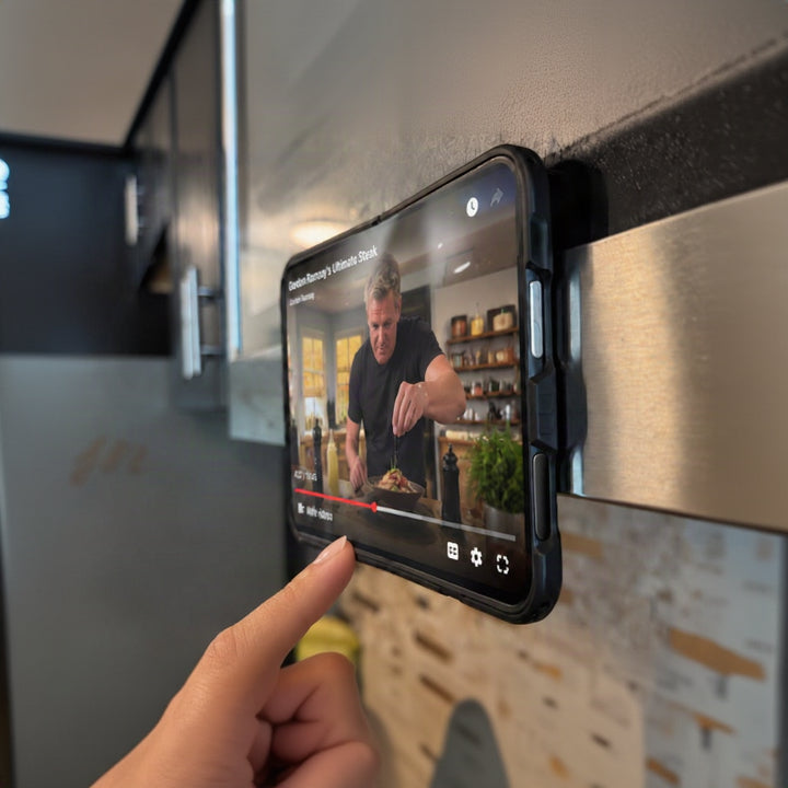 iPhone Duo mounted on a metal surface in a kitchen
